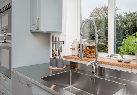 Denco31 Luxury Light Grey Shaker Kitchen Cabinets | Brass Hardware & Stainless Steel Countertops